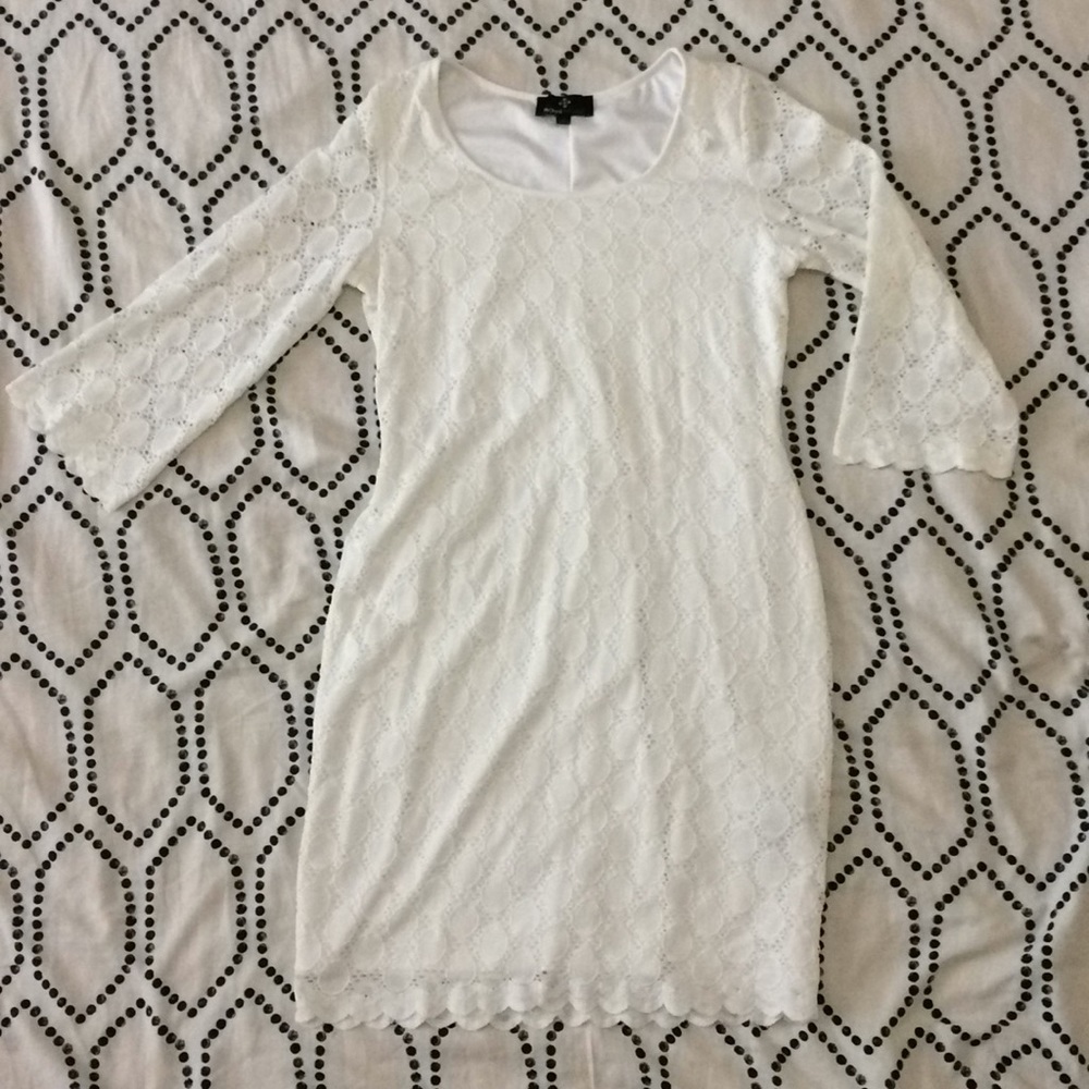White dress. Knee length w/ elbow length sleeves